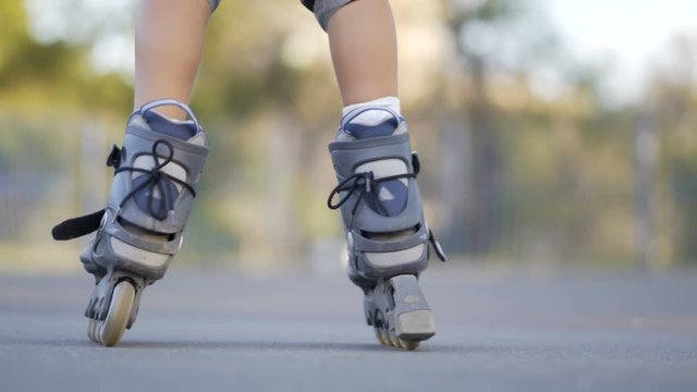 Rides roller skates. Litle boy