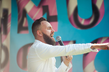 Presenter on stage with microphone