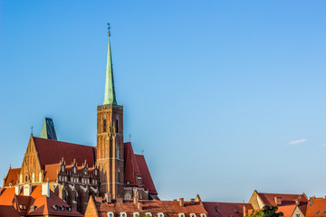 Obraz premium tourism concept of old medieval colorful city center district with catholic cathedral towers and different small houses