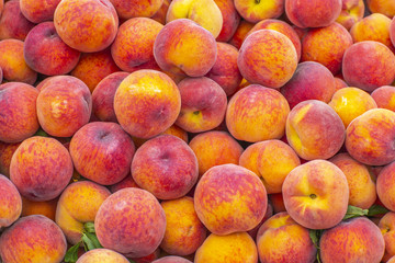 Fresh ripe peaches at farmer's market in California
