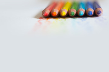 Obraz premium Color pencils on white background, copy space