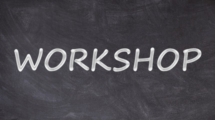 Obraz premium Workshop text on blackboard