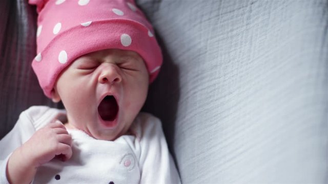 Sleepy Yawning Newborn Baby