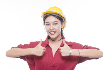 Engineering woman give a thump up in red shirt with yellow safety helmet in Studio light
