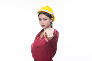 Engineering woman pointing in red shirt with yellow safety helmet in Studio light, occupation concept, Construction preparation, Happy worker