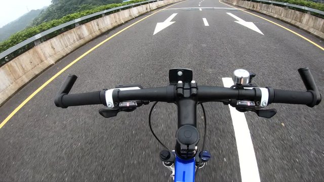 Riding bike on highway road hands free