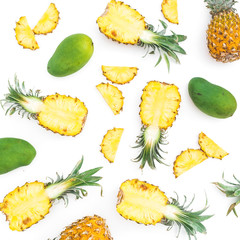 Tropical fruit background of pineapple and mango fruits on white background. Flat lay, top view. Food concept.