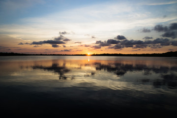 Sunset with fluffy clouds at the lagoon in Utila, Honduras, Central America