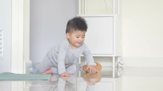 Baby boy is crawling in the room at home, Infant to crawl concept, Slow motion