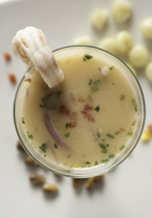 Peruvian seviche LECHE DE TIGRE. Raw fish cocktail ceviche with lime, grinder, chili and cilantro.