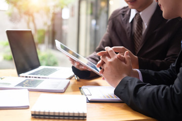 Business working consult discussion on work table with tablet.
