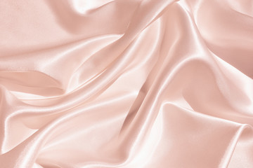 The texture of the satin fabric of pink color for the backgroundит