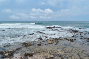 beautiful beach with cloudy sky