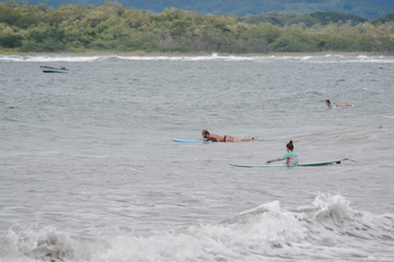 girl on the beach surfing
