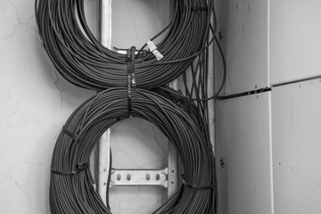 Black and white photo of neatly wound wires
