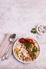 Slices of fried fish with vegetables