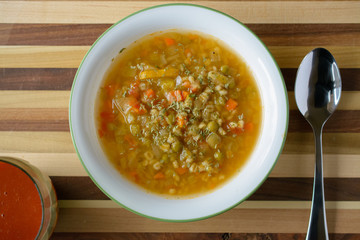 Rural pottage on table with spoon