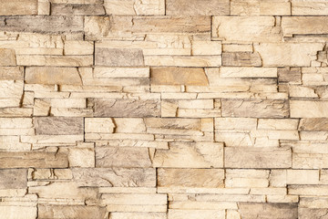 Brown stone tile wall texture and background