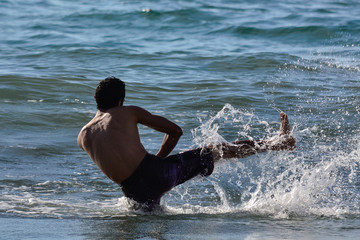boy practicing on the beach