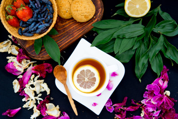 Cup of tea and mint on a dark background