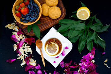 Cup of tea and mint on a dark background