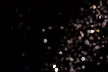 bokeh of water drops levitating in the air reflection