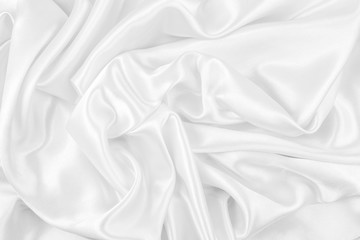 Luxurious of smooth white silk or satin fabric texture background