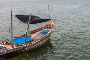 Fototapeta na wymiar Orange wood fishing boat