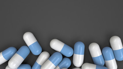 Pile of white and blue medicine capsules - 219065195