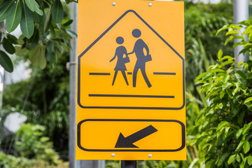 Traffic sign School warning sign here with green leaf