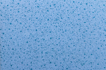 close up of a blue ceramic tile with dark blue dot pattern