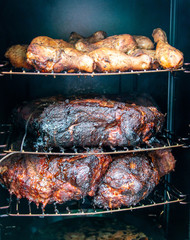 smoking delicious meat and chicken in the smokehouse food concept