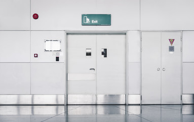 Steel Security Door and Fire Protection System in Airport Terminal, Emergency Exit Gate Doorway and Alarm Fire Prevention. Architecture of Steel Doors and Corridor Flooring in Lounge Boarding Gate 