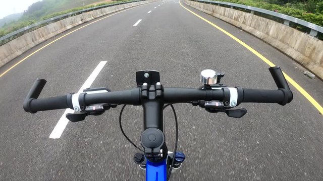 Riding bike on highway road hands free