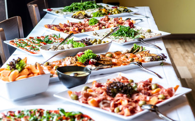 Party Brunch big Buffet table setting with Food Meat Vegetables