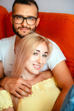 Closeup portrait of happy young couple at home