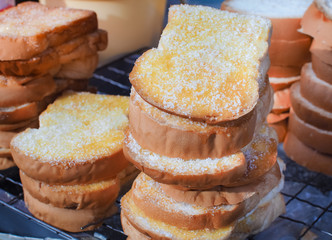 Sliced toast bread with butter and sugar topping. grilled over charcoal.