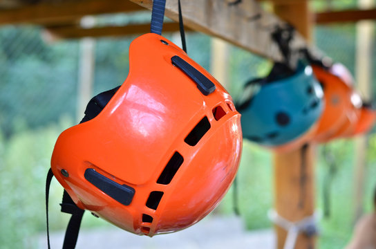 Protective helmets hanging on the rack.