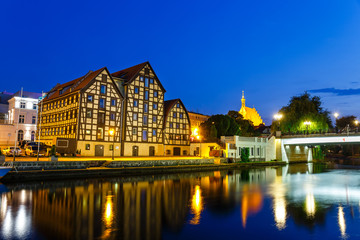 Fototapeta na wymiar The waterfront with famous granaries at night in Bydgoszcz, Poland