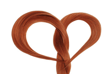 Long henna hair in shape of heart on white background. Hair care concept 