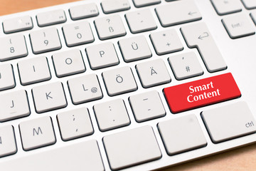Smart Marketing written on red button of computer laptop keyboard