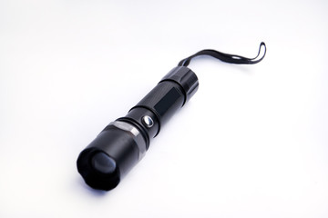 Black flashlight isolated on white background