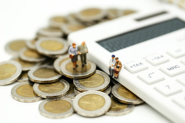 Miniature people : Couple oldman standing with Calculator,business,tax concept.