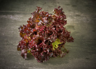red lettuce on wooden background