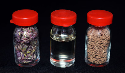 Unusual bottles, spices for cooking. Seasonings for vegetables and meat. Bottled olive oil. Dill and pepper seeds in beautiful bottles. Containers for spices. Oriental cuisine.