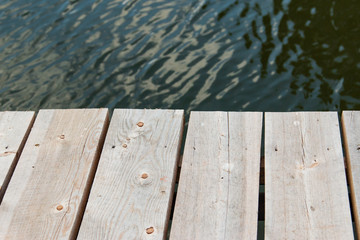 wooden planks on the background of water