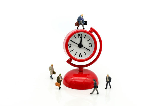 Miniature people : Businessman watching the time using for concept Be Late For Something Day.