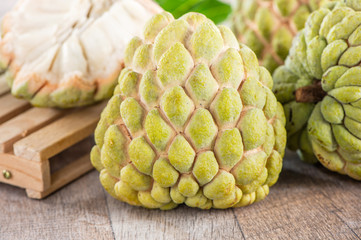 fresh sugar apple fruit(Custard Apple),sweetsop on wooden table background