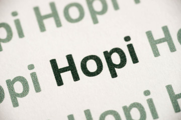 Fototapeta premium word Hopi language printed on paper macro