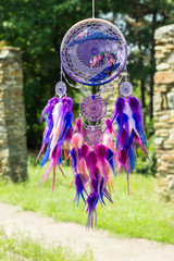 Obraz premium Handmade dream catcher with feathers threads and beads rope hanging